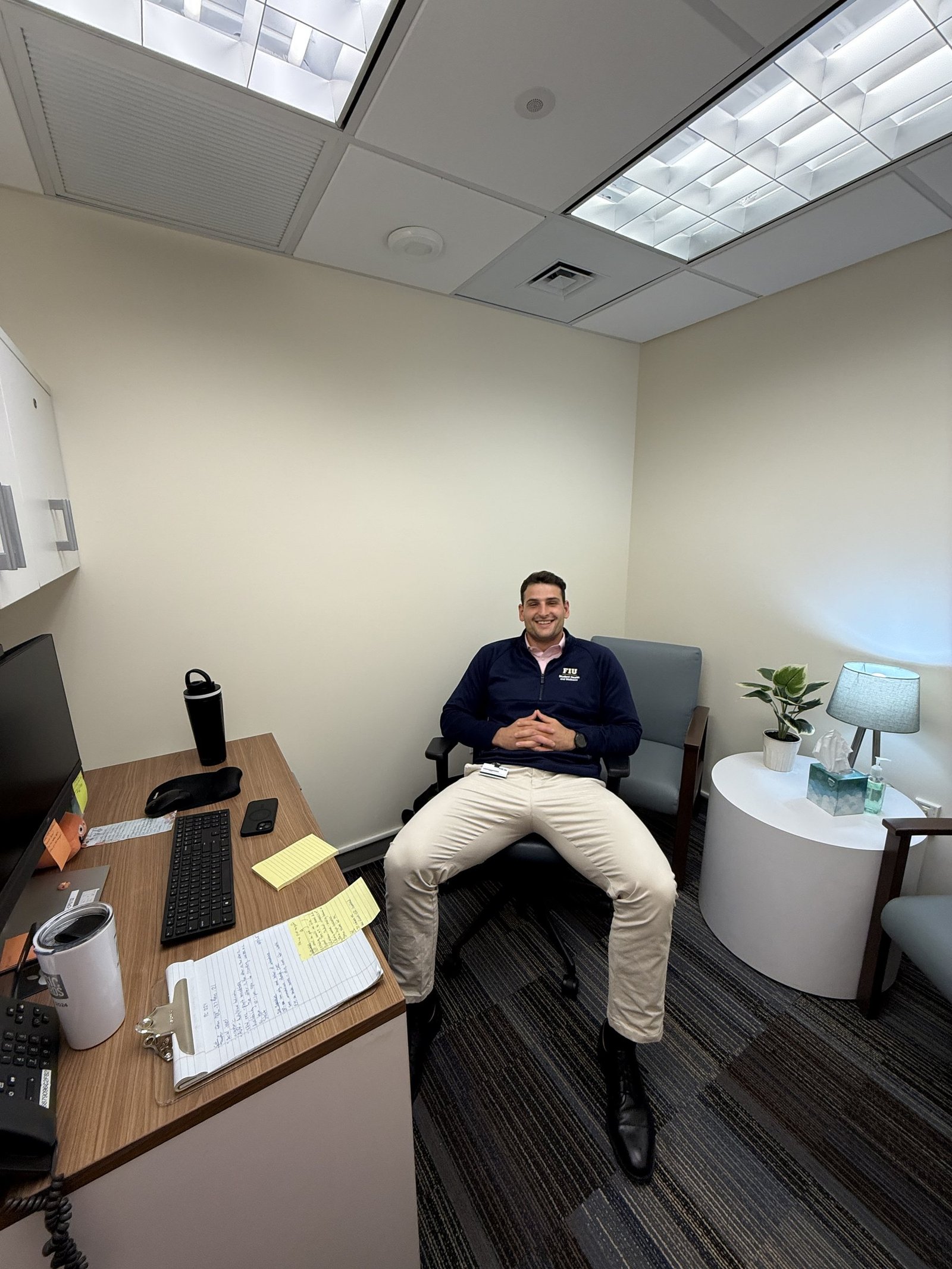 Korab Idrizi seated in his clinical office