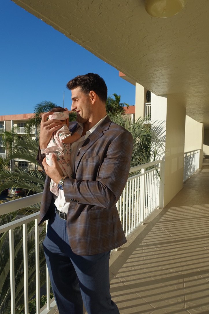 Korab Idrizi holding his daughter